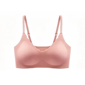 Detailed view of pink seamless bra featuring wavy scalloped edges and adjustable straps
