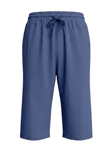 Close-up of dark blue linen shorts with elastic drawstring waist and breathable fabric texture