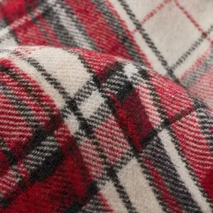 Detailed close-up showing soft texture and red plaid pattern of the Christmas stocking fabric