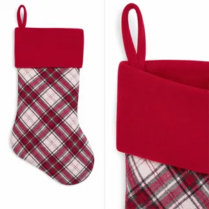 Macro shot of red plaid Christmas stocking with durable loop and soft velvet cuff detail