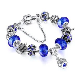 Silver snake chain bracelet featuring royal blue Austrian crystal and crown pendant