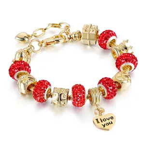 Gold-plated charm bracelet with red crystals and I love you heart pendant charm