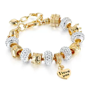 Gold charm bracelet with crystal beads and heart pendant featuring I love you engraving