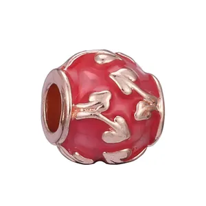 Red enamel bead with rose gold leaf patterns for DIY charm bracelet jewelry making