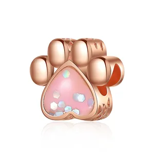 Rose gold animal paw print charm with pink glitter and hollow heart side details
