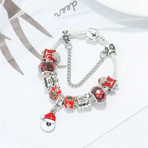 Silver snake chain charm bracelet with Santa Claus pendant and festive red beads