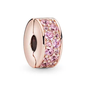 Rose gold crystal charm spacer bead with sparkling pink pave stones on white background