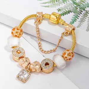 Luxurious gold-plated charm bracelet with sparkling heart beads and square crystal pendant