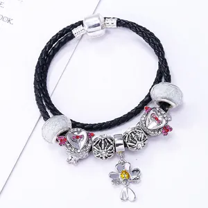 Luxurious black braided leather charm bracelet with silver floral and heart pendants