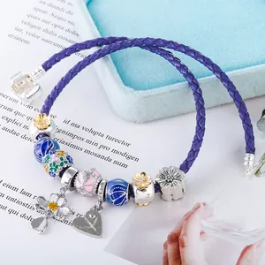 Charming purple leather wrap bracelet with colorful daisy beads and floral pendants