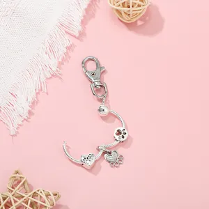 Detailed silver metal keychain featuring I love my dog heart bead and paw print charms
