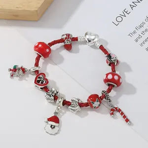 Red braided cord Christmas bracelet with Santa Claus and mushroom charms