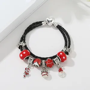 Christmas leather beaded bracelet with Santa Claus and Merry Christmas charms on white background