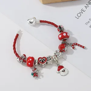 Christmas beaded bracelet with red leather cord, Santa charms, and silver heart clasp