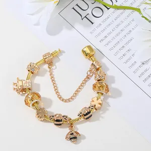 Golden bee charm bracelet with yellow crystal beads and crown spacers in high quality finish
