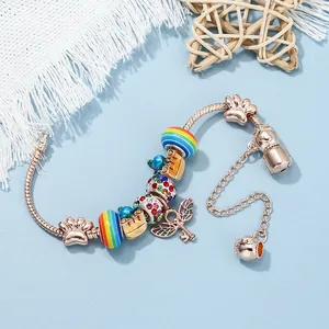 Rose gold snake chain bracelet featuring colorful unicorn, rainbow beads and charms