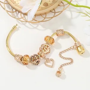 Pulsera de dijes dorada con cuentas de ámbar, colgante de corazón y cierre con sello 925
