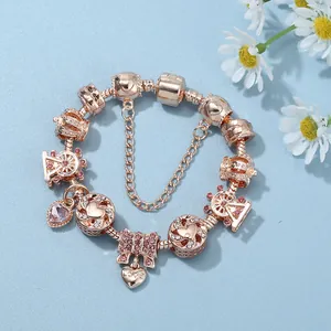 Rose gold ferris wheel charm bracelet with crown, heart pendants and pink zircon crystal bow