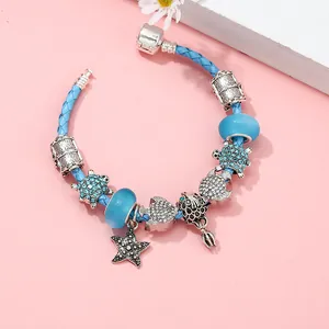 Bracelet à breloques océan bleu avec tortue marine et étoile de mer en argent sur corde tissée
