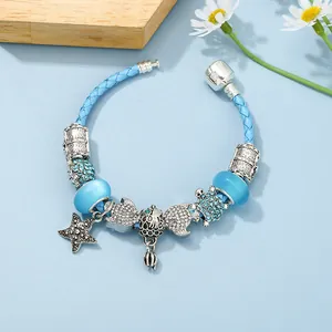 Bracelet en cuir tressé bleu avec charmes étoile de mer et tortue en argent serti