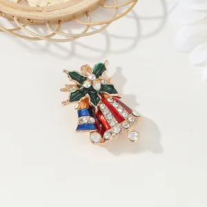 Christmas jingle bell brooch with red and blue enamel, holly leaves and crystals