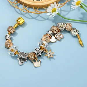 Classic DIY charm bracelet with gold crown, heart pendants and sparkling crystals