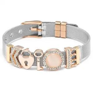 Silver mesh bracelet with rose gold crown charms and pink cat eye stone accents