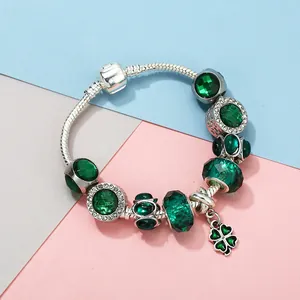 Emerald green beaded clover pendant snake chain bracelet with sparkling crystal accents