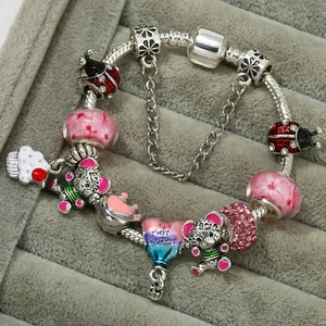 Silver snake chain charm bracelet with pink glass beads and bear cupcake pendants