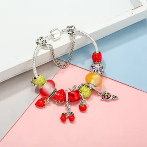 Summer fruit themed charm bracelet with pineapple and cherry pendants and silver snake chain