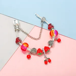 DIY strawberry and cherry beaded charm bracelet with red glass beads and silver snake chain