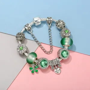 Silver snake chain bracelet with green beads and heart pendant engraved with Love