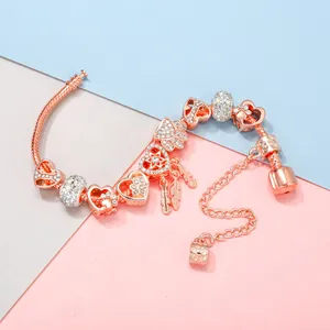 Elegant rose gold dreamcatcher charm bracelet with openwork hearts and crystal beads