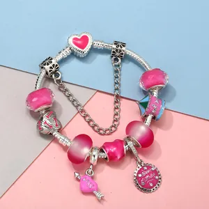 Silver snake chain bracelet featuring pink faceted beads and romantic castle charms