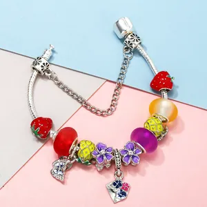 DIY charm bracelet with summer fruit enamel pendants and colorful glass beads on snake chain