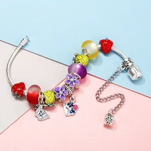 Silver snake chain bracelet with colorful enamel strawberry, pineapple, and flower charms