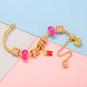 Golden Ferris Wheel charm bracelet with pink glass beads and red enamel pendant for women