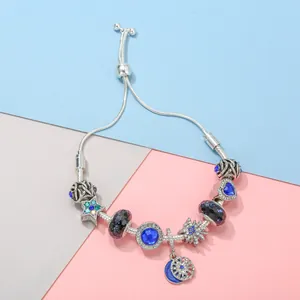 Silver snake chain bracelet with blue crystal charms and adjustable ball clasp