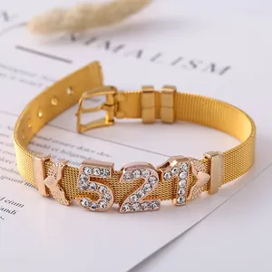 Macro view of gold mesh bracelet with sparkling 521 number charm and rhinestones