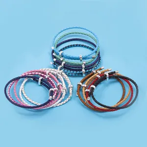 Multiple colorful braided leather bracelets with silver metal clasps in various shades