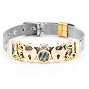 Detailed view of silver mesh bracelet featuring golden Love charms and heart locks