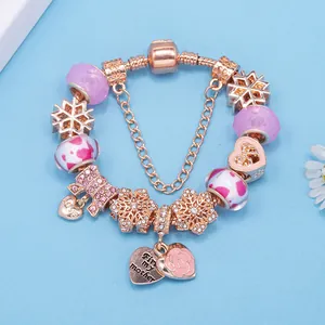 Bracciale a maglia蛇骨 oro rosa con charm viola, pendente a cuore e catena di sicurezza