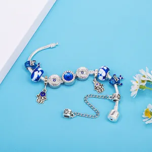 Blue evil eye and hamsa hand charm bracelet with silver snake chain and crystal beads