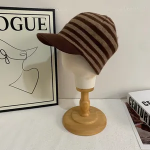 Chic striped knit baseball cap in coffee and beige colors for winter warmth