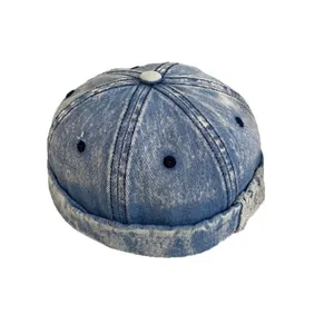 Vintage washed blue denim skull cap for men and women with distressed ripped details