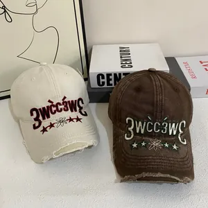 Distressed vintage baseball cap with embroidery and ripped details in beige and brown