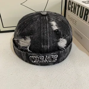 Acid-wash black denim brimless miki hat with distressed details and CREATE embroidery