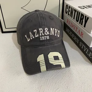 Close-up of vintage dark gray baseball cap with 3D embroidery and printed 19 on brim