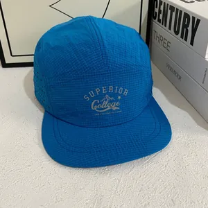 Breathable blue 5-panel camper hat with laser-cut holes and quick-dry mesh fabric