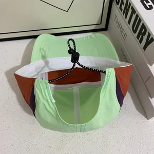 Detail of adjustable elastic drawstring and sweatband on quick-dry color-block baseball cap